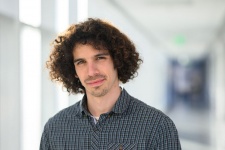 Eli Sanchez posing in front of a hallway